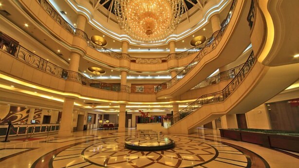 A multi-level atrium with a central circular design, multiple balconies, and a grand chandelier. - Country Garden Phoenix Hotel Jingmen (Jingmen)