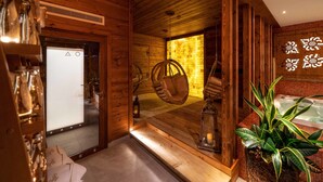 A wooden cabin interior with a hanging chair, a bathtub, and a large mirror reflecting the room. - Gold Hotel (Zakopane)