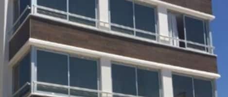 A multi-story hotel with a modern design, featuring large windows and a prominent sign reading "Hotel SEAMVIEW".