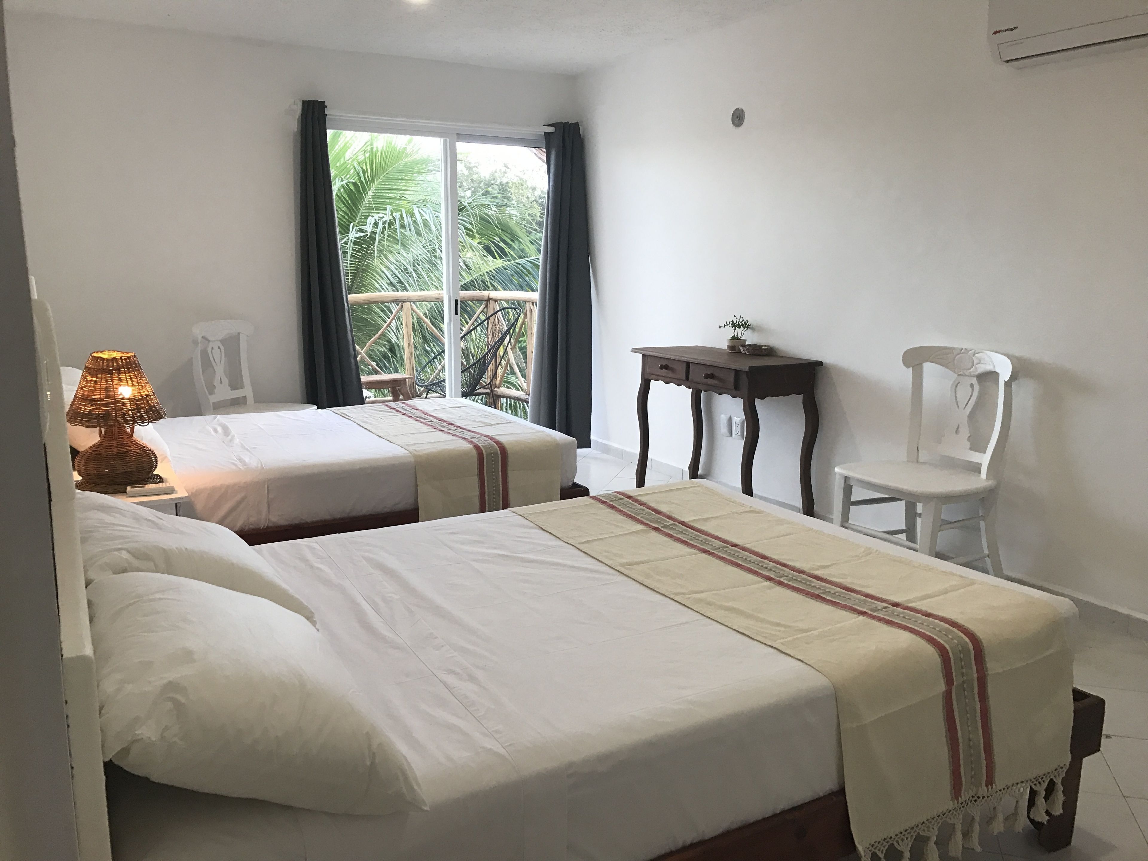 room, 2 queen beds, balcony, garden view | view from room