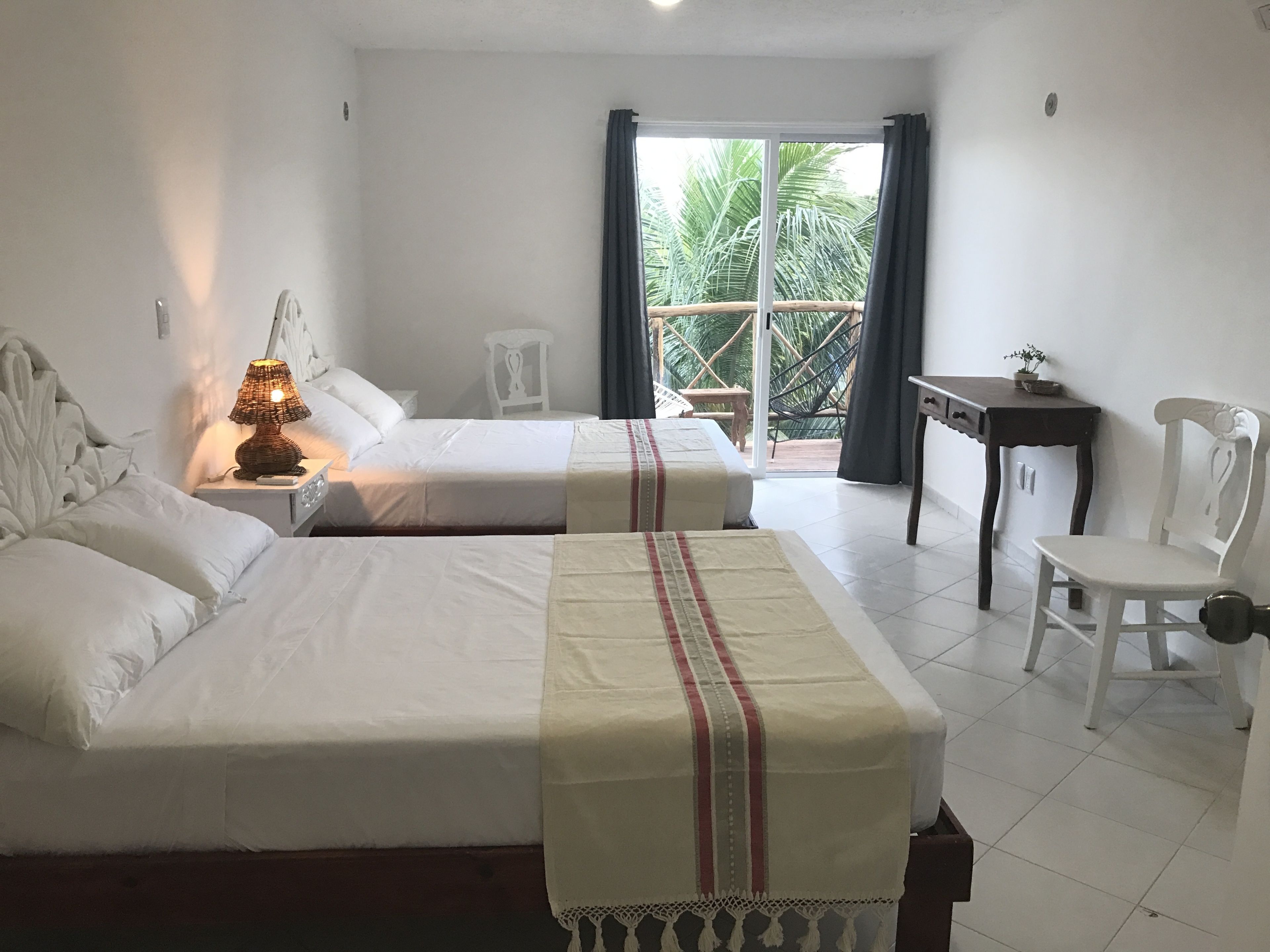 room, 2 queen beds, balcony, garden view | 1 bedroom, in-room safe, desk, free wifi