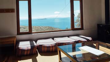 Suite familiar, 2 habitaciones | Área de sala de estar