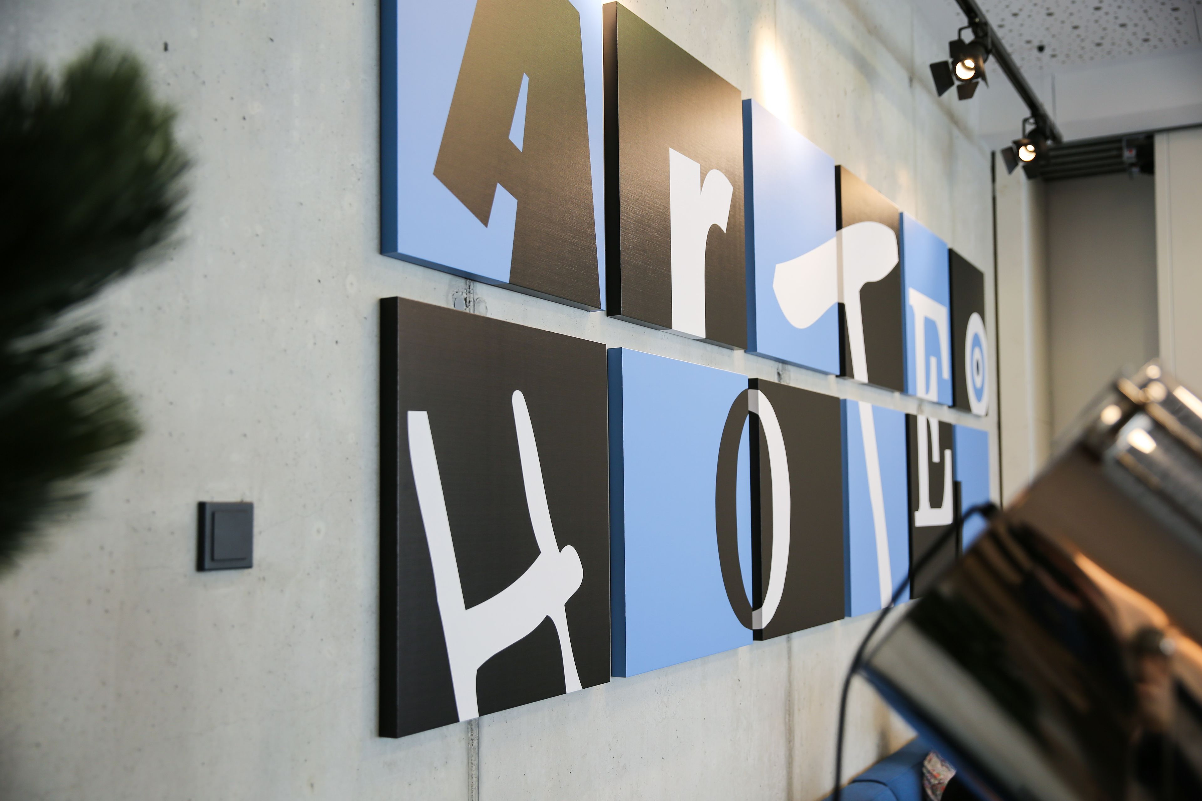 A wall with large, bold letters spelling out "ART HOTEL".
