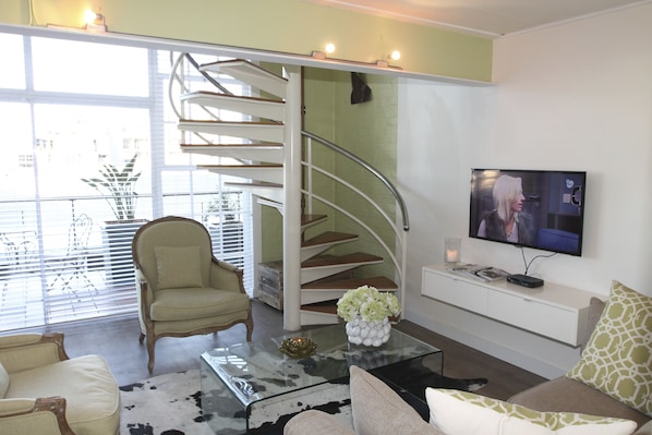 Apartment (1 Bedroom) | Living room | 65-inch flat-screen TV with satellite channels, plasma TV - The Studios 315 by CTHA (Cape Town)