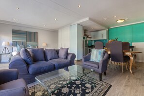 Appartement, 1 chambre | Salle de séjour | Téléviseur à écran plat