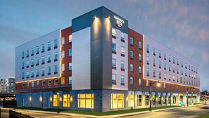A multi-story hotel with a modern design, featuring a prominent "Homewood Suites" sign. - Homewood Suites by Hilton Boston Logan Airport Chelsea (Chelsea)