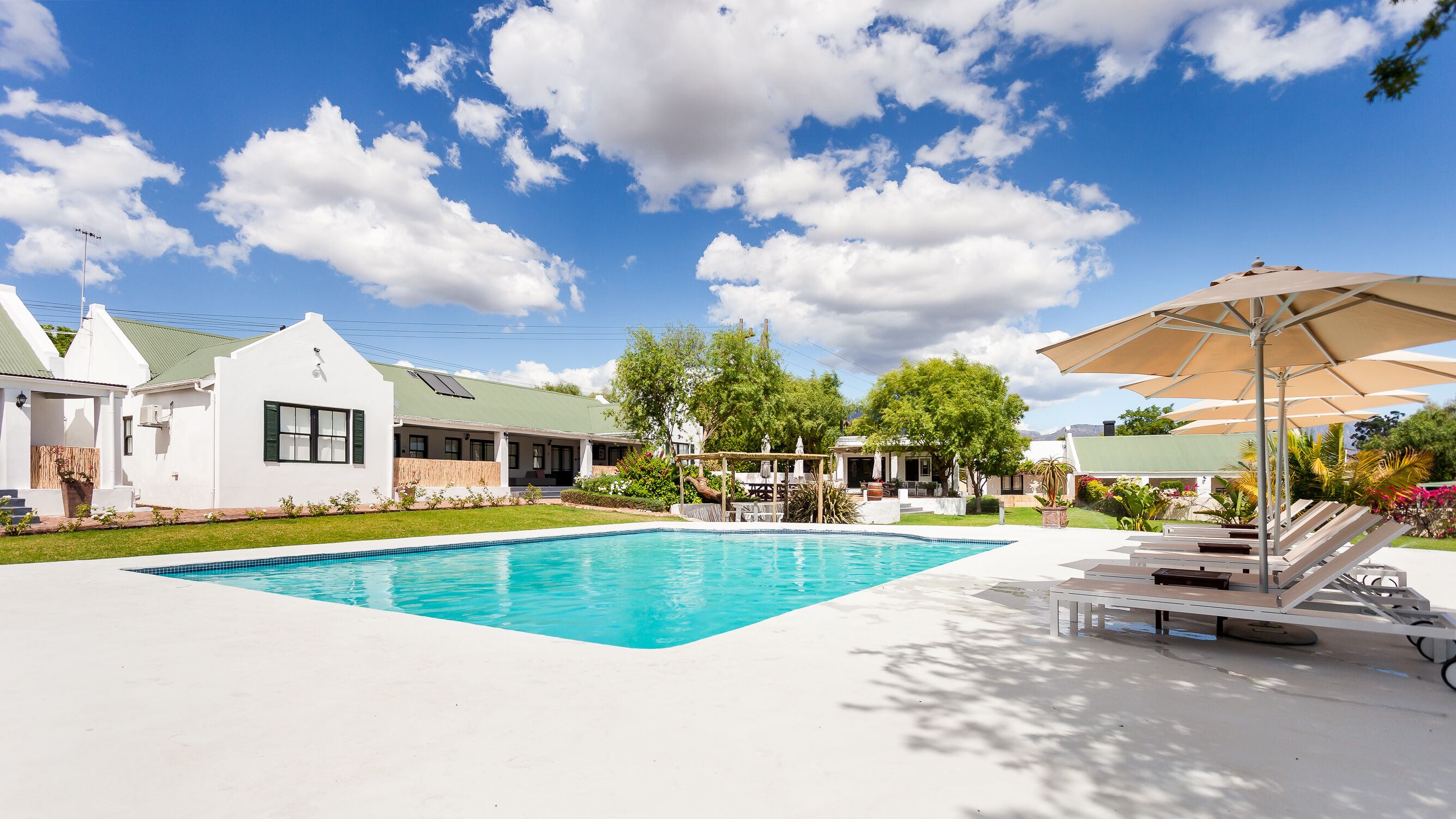 Outdoor pool, pool umbrellas, pool loungers