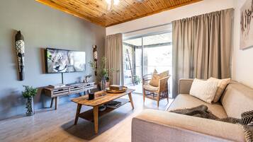 Family Apartment, 2 Bedrooms, Balcony | Living area | 50-inch Smart TV with satellite channels, TV, Netflix