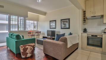 Apartment (1 Bedroom) | Living area | Flat-screen TV, DVD player