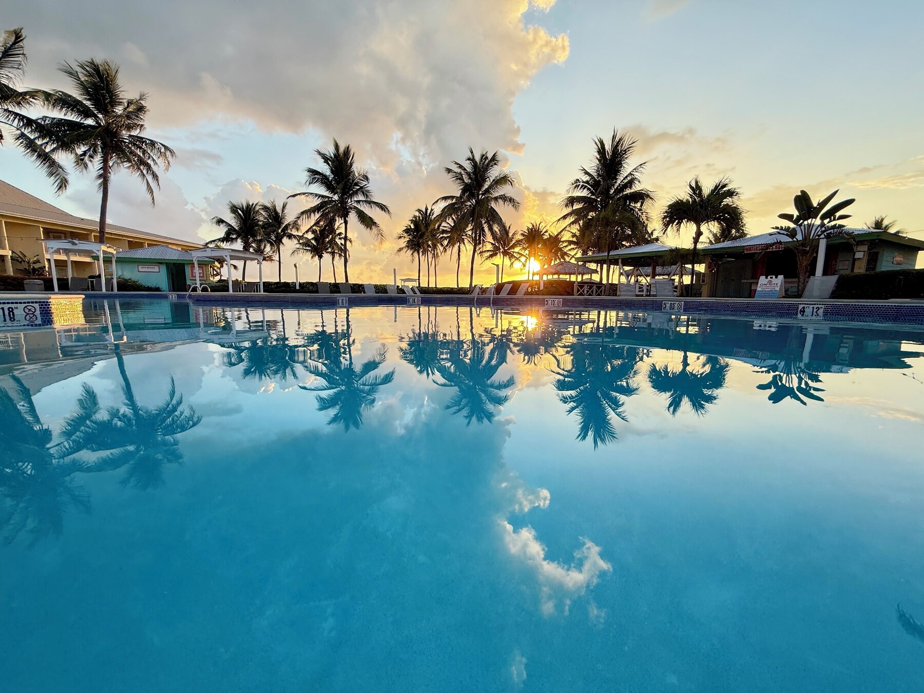 Outdoor pool, open 7:00 AM to 10:00 PM, pool umbrellas, sun loungers