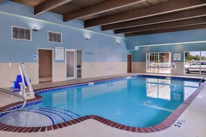 A swimming pool with a lifeguard chair, pool rules sign, and a no diving allowed sign. - Holiday Inn Express & Suites Siloam Springs by IHG (Siloam Springs)