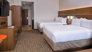 A hotel room with two beds, a TV, a desk with a chair, and a bathroom door. - Holiday Inn Express & Suites Siloam Springs by IHG (Siloam Springs)