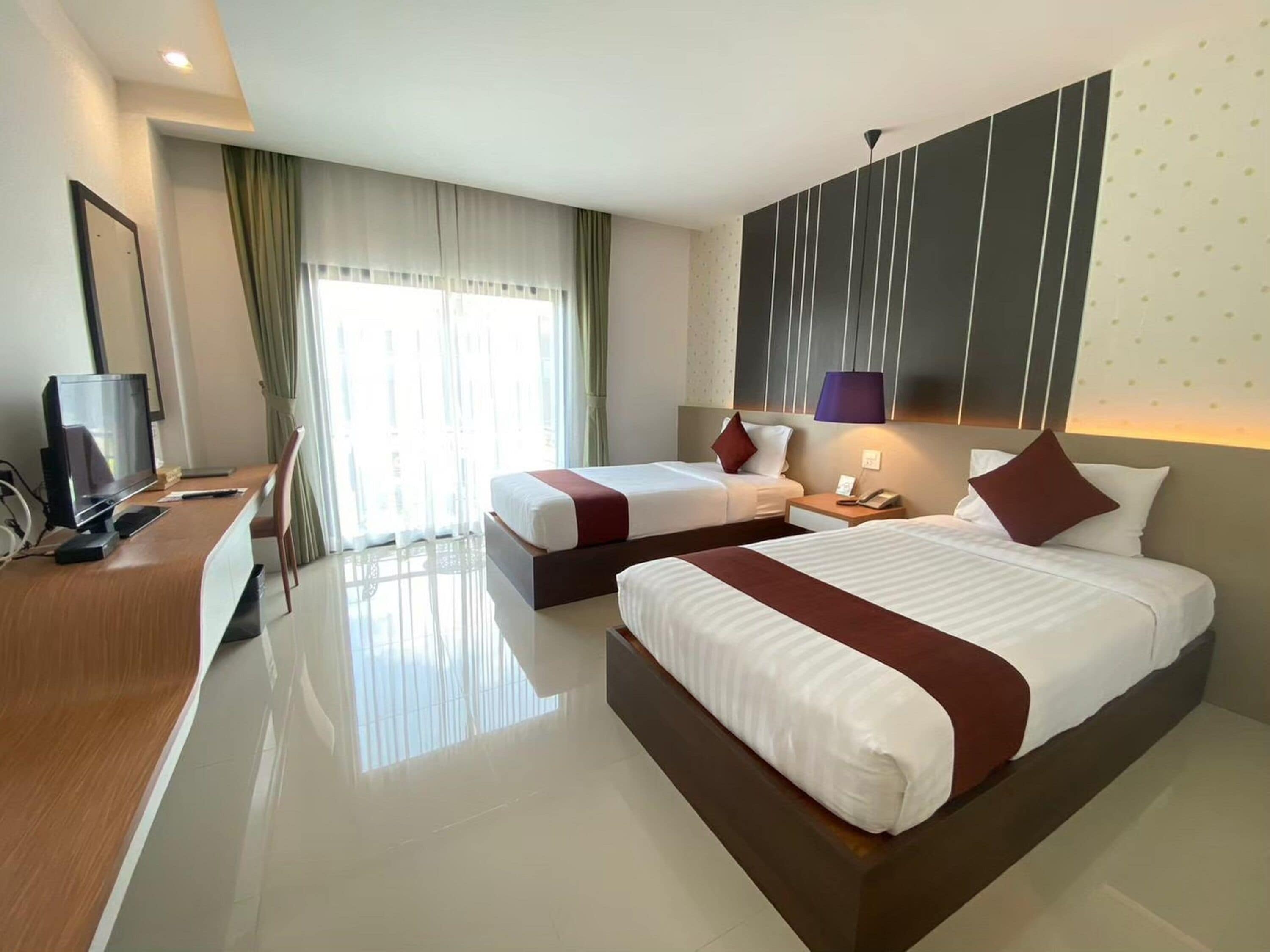 deluxe double room or twin room | in-room safe, desk, rollaway beds, free wifi