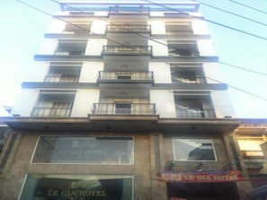 A multi-story hotel with balconies on each floor. - Le Gia Hotel (Ho Chi Minh City)
