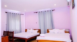 Family Room | Minibar, desk, rollaway beds, free WiFi - New Sun Phu Quoc Hotel 2 (Phu Quoc)