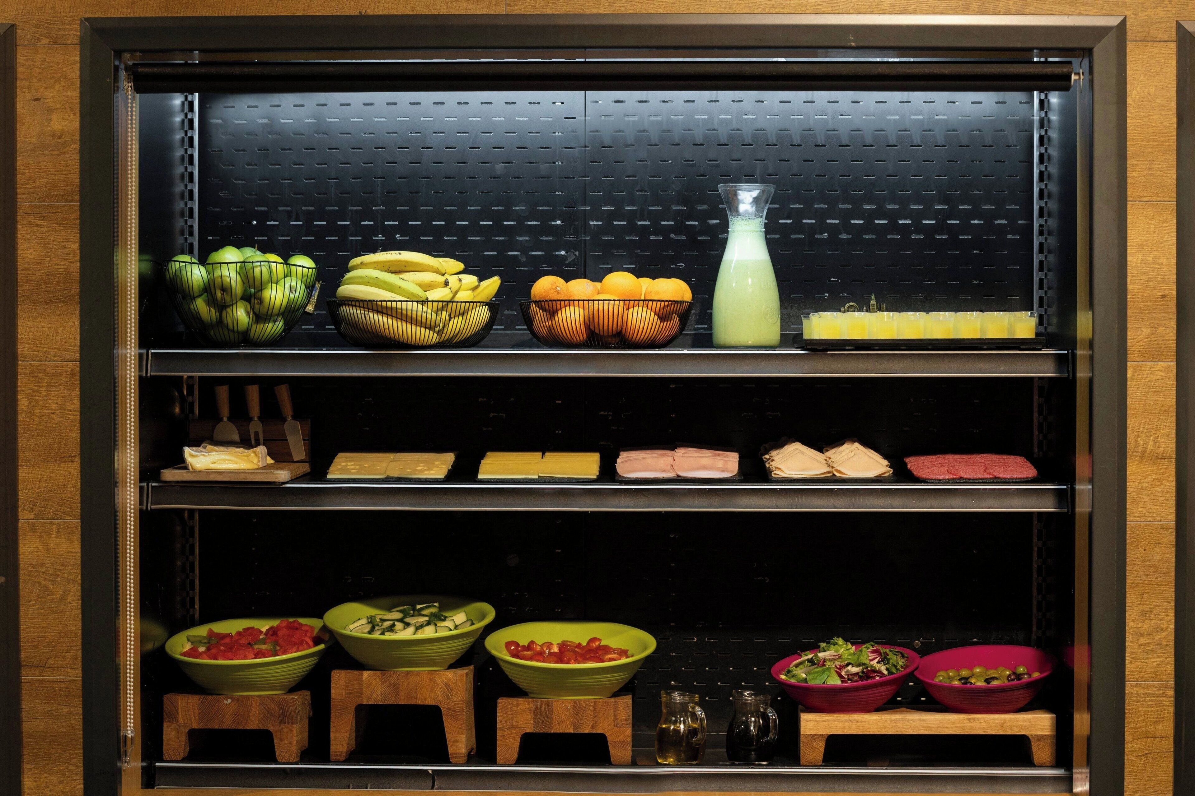 A kitchen with various food items and kitchenware.
