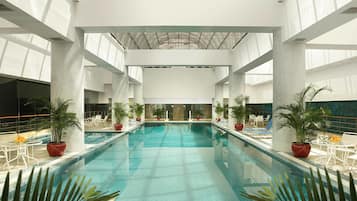 Indoor pool, open 6:00 AM to 11:00 PM, sun loungers, lifeguards on site