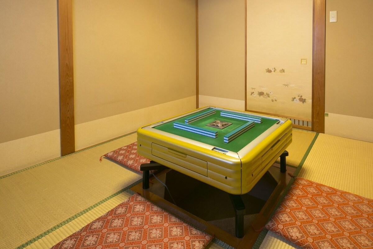 A tatami mat room with a pool table.