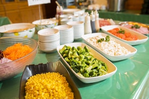Enjoy a spread of fresh vegetables, rice, and grains at our buffet.