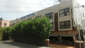 A building with the sign "Hilton Hotel" indicating it is a hotel. - Hilltop Hotel (Karachi)