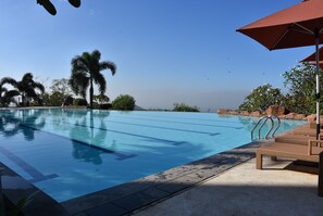 2 outdoor pools, open 9:00 AM to 5:00 PM, pool umbrellas, sun loungers