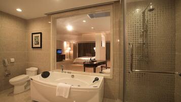 Deluxe Suite | Bathroom | Separate tub and shower, free toiletries, hair dryer, bathrobes