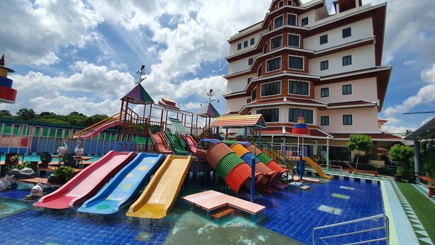 A water park with multiple slides and a pool area. - Doungta Anda Hotel (Krabi)