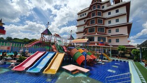 A water park with multiple slides and a pool area. - Doungta Anda Hotel (Krabi)