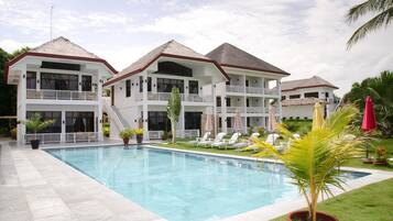 Outdoor pool, pool umbrellas, sun loungers