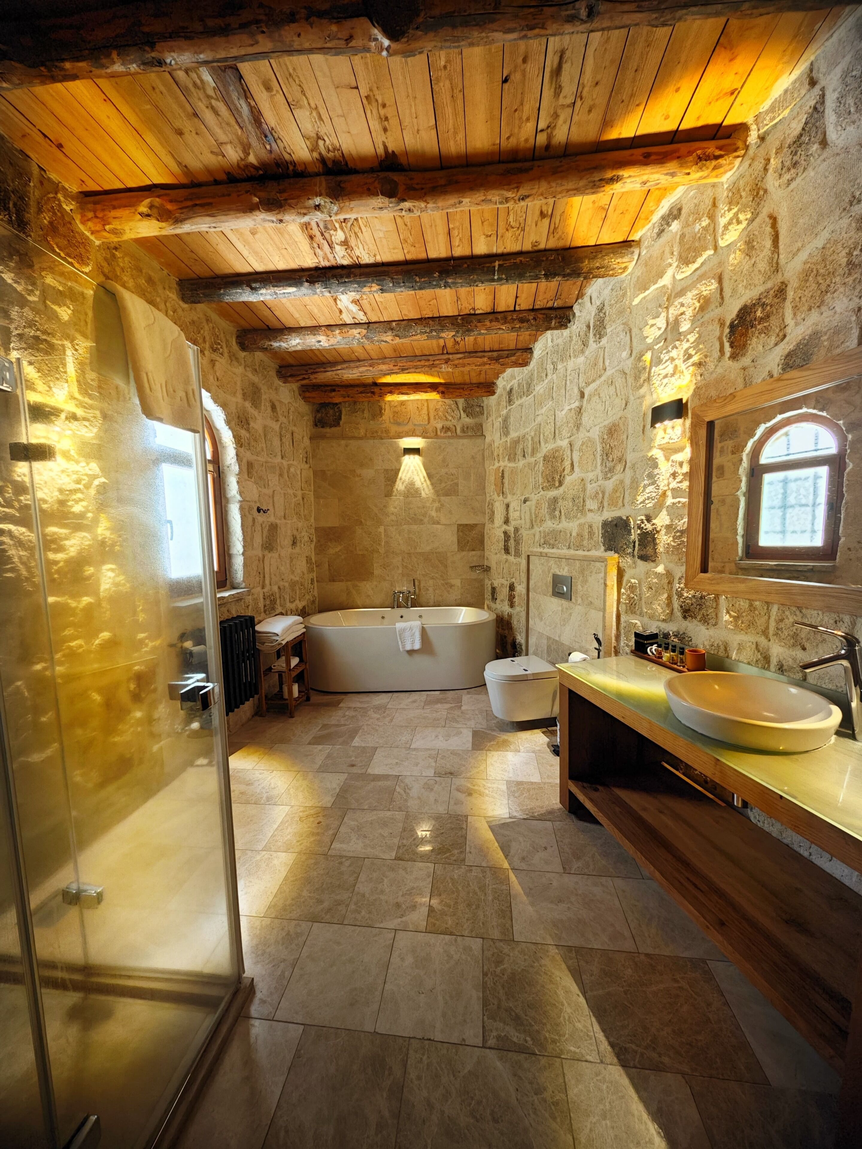 exclusive cave suite | bathroom | free toiletries, hair dryer, slippers, towels