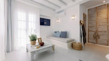 Deluxe Suite, Sea View | Living area | 32-inch LED TV with satellite channels, TV