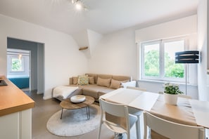 Family Studio, 2 Bedrooms, Kitchen | Living area | Flat-screen TV