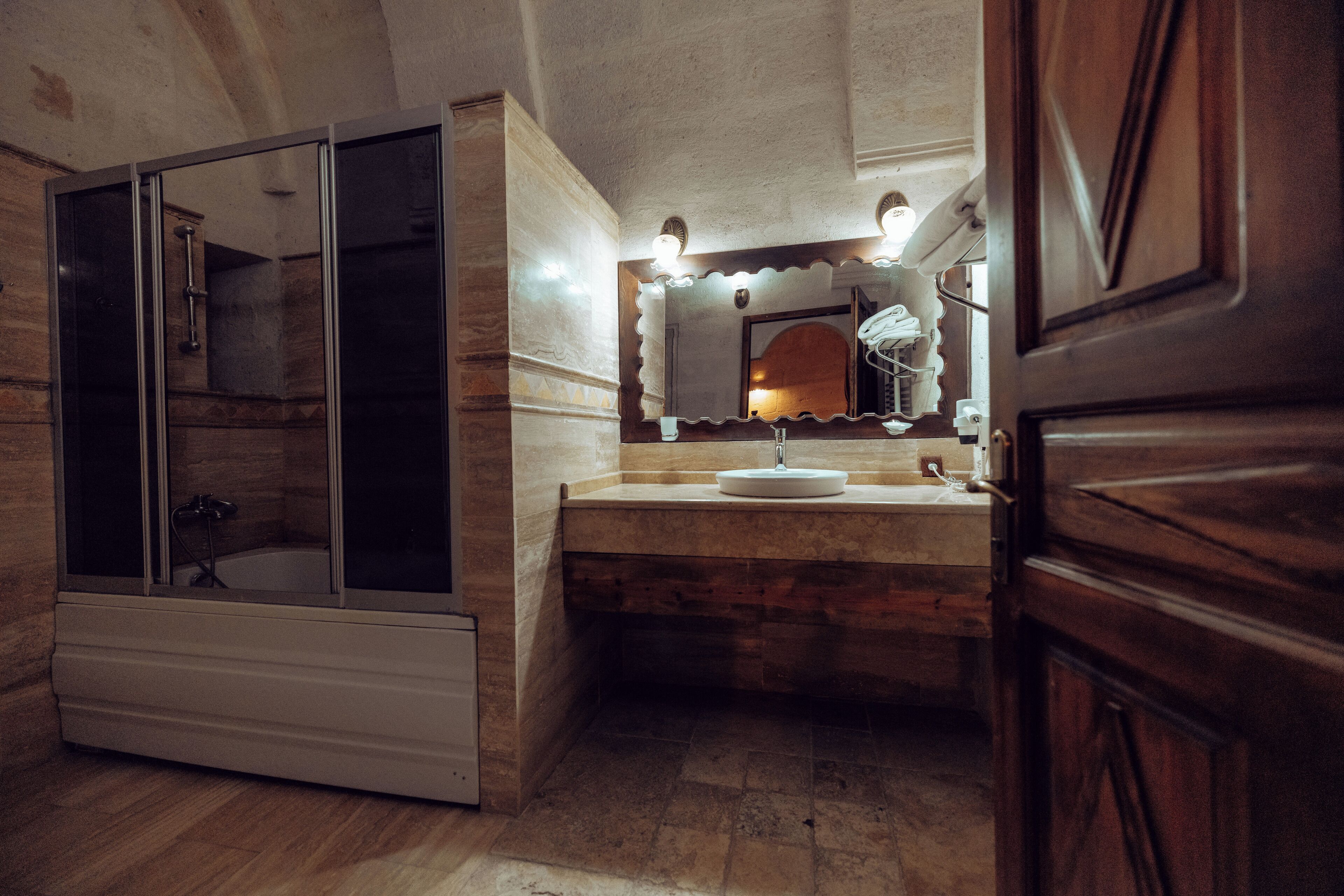 comfort suite | bathroom | hair dryer, slippers, towels, soap