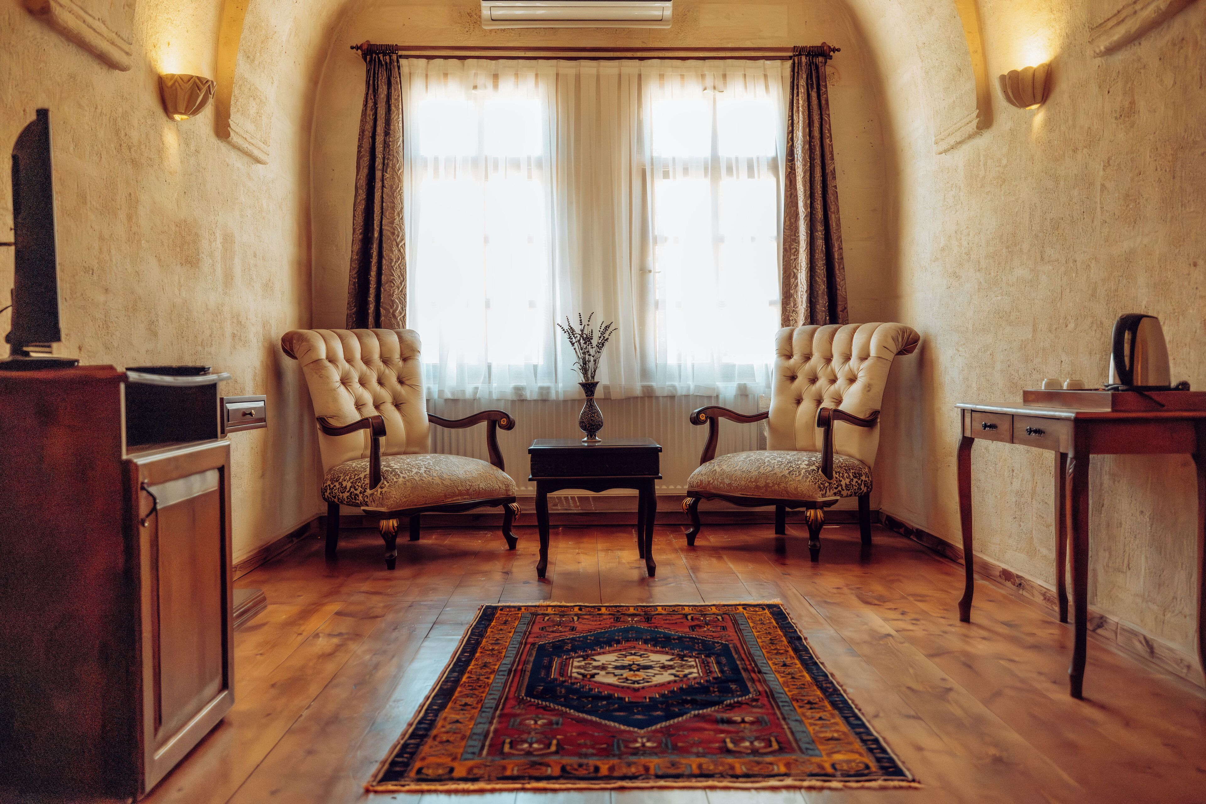 comfort suite | living area | 80-inch tv with satellite channels, ping pong, books