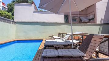 Outdoor pool, open 10:00 AM to 8:00 PM, pool umbrellas