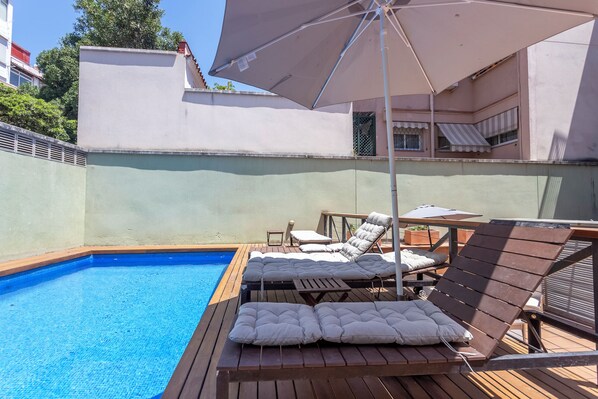 Outdoor pool, open 10:00 AM to 8:00 PM, pool umbrellas, sun loungers