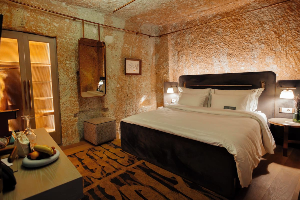 Comfort Cave | Premium bedding, minibar, in-room safe, blackout drapes