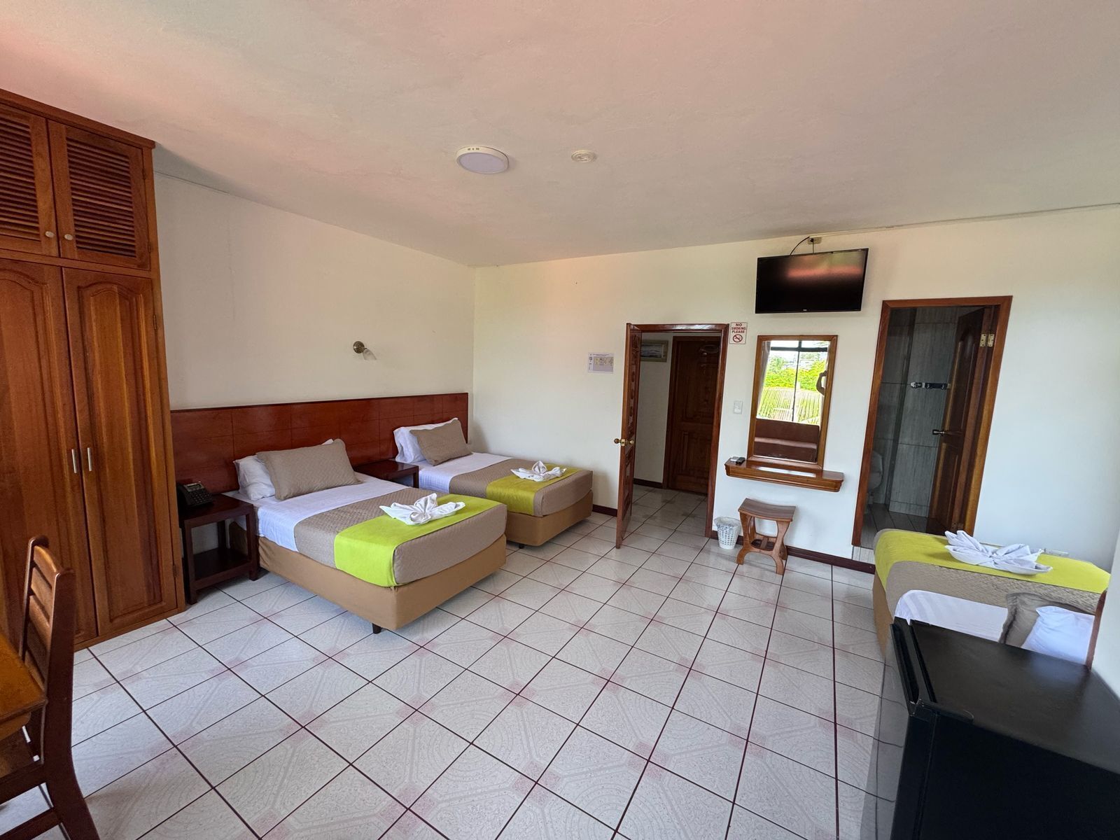 economy triple room, private bathroom | in-room safe, desk, iron/ironing board, free wifi