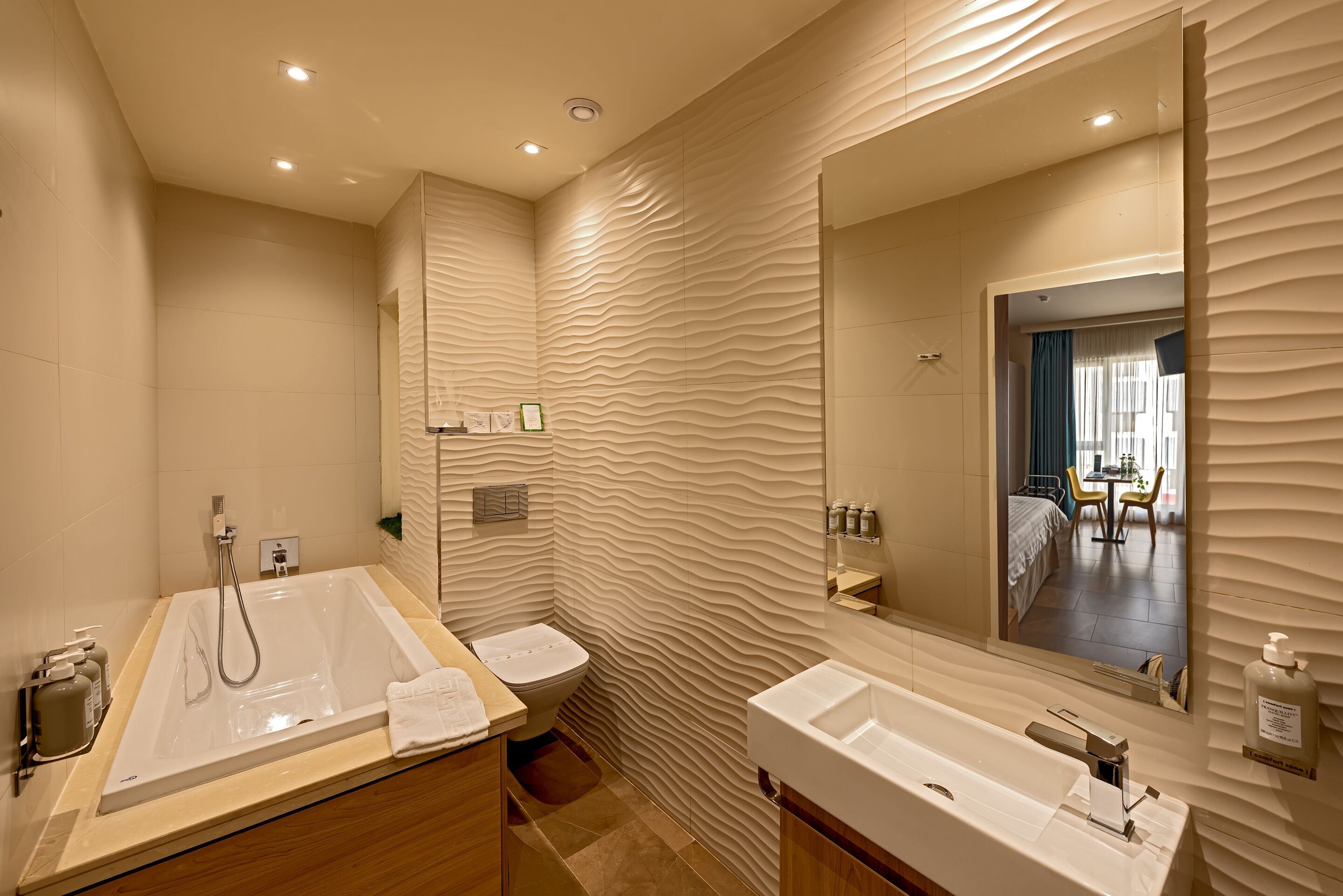 comfort quadruple room | bathroom | designer toiletries, hair dryer, bathrobes, slippers