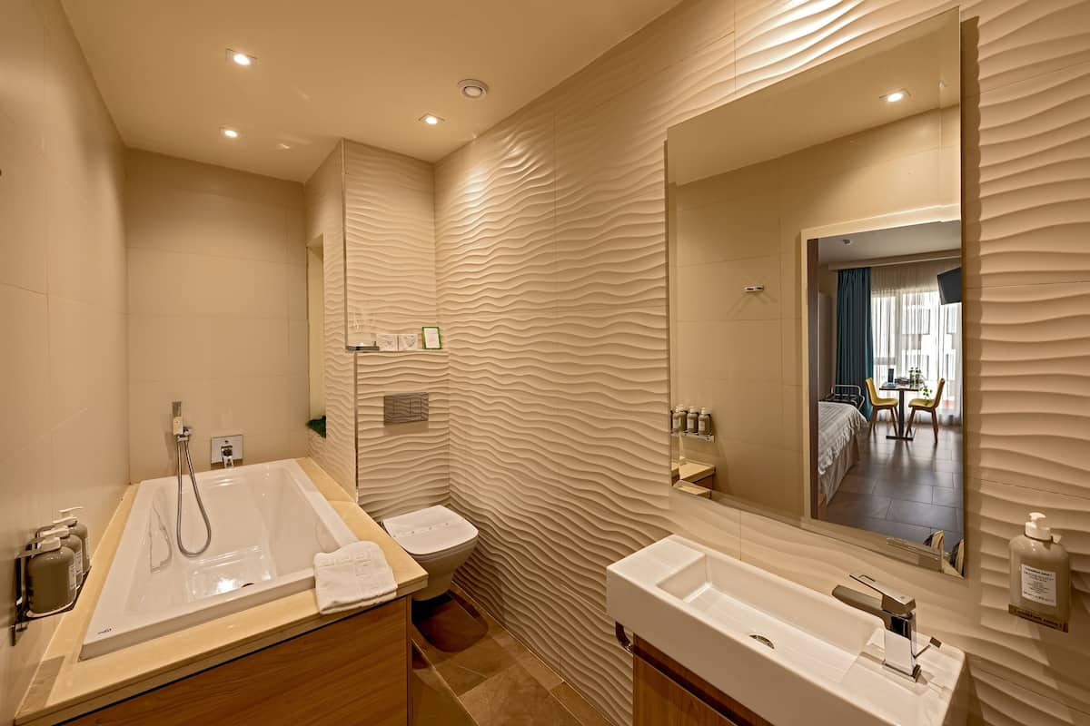 comfort quadruple room | bathroom | designer toiletries, hair dryer, bathrobes, slippers