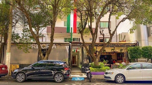 A street view with a restaurant named 'PRINCIPE' and a flag above it. - Hotel VIVE MX wtc CDMX, Trademark Collection by Wyndham (Mexico City)