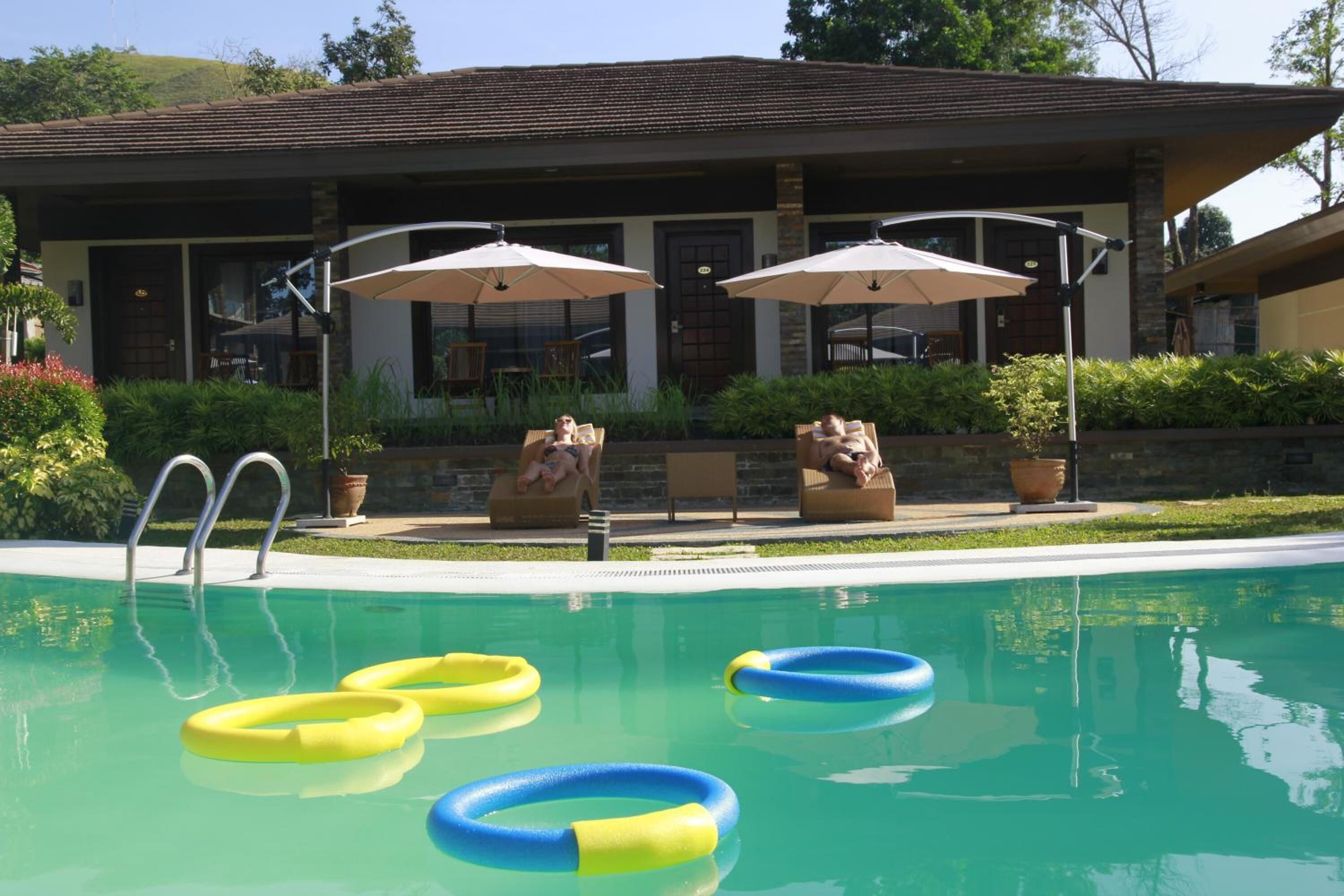 outdoor pool, pool umbrellas, pool loungers