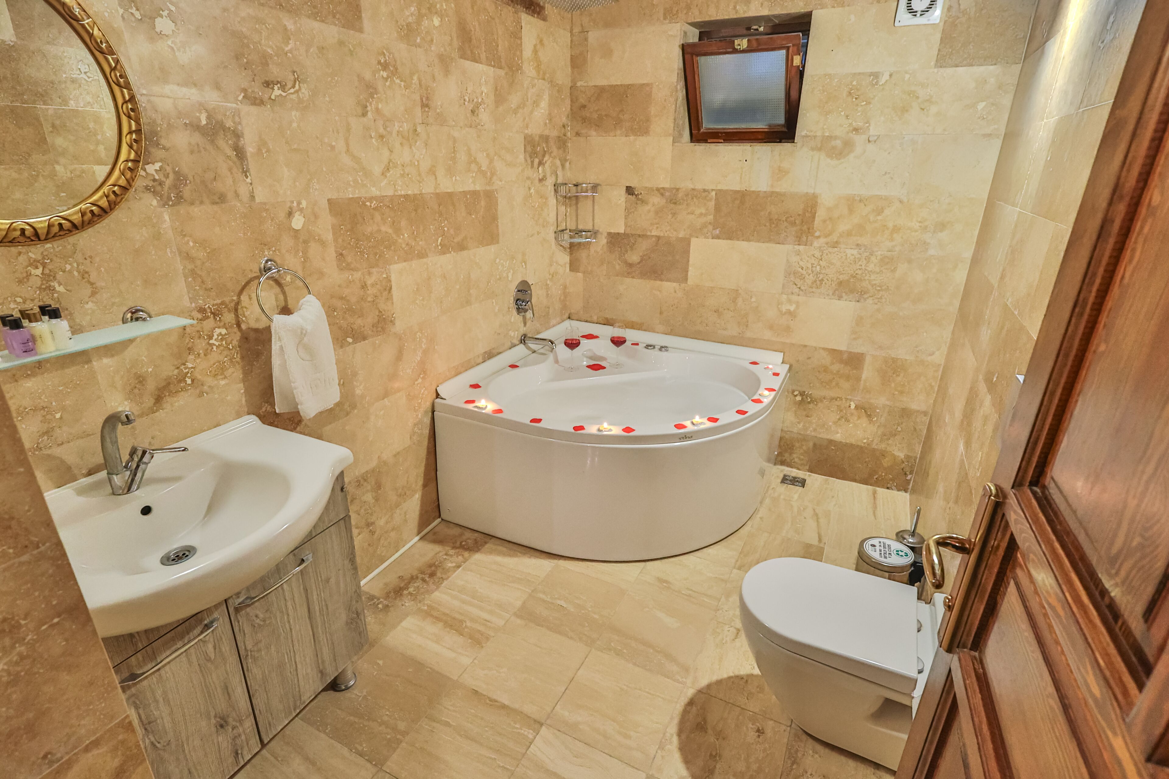 A bathroom with a sink, toilet, and bathtub.