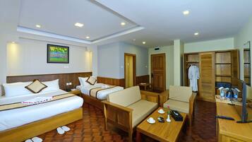 Family Triple Room, 1 Bedroom | Minibar, in-room safe, desk, iron/ironing board