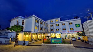 A multi-story hotel with a prominent sign reading "HOTEL IN VALLEY YANGON". - Hotel H Valley Yangon (Yangon)