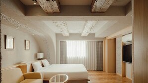 A hotel room with a large bed, a sofa, a small table, and a TV. - Nest Hotel Olt Kawasaki Station (Kawasaki)