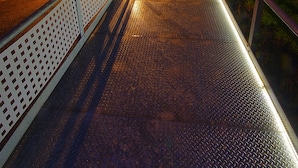 A metal staircase leading to a hostel with a sign reading "All Iron Hostel." - All Iron Hostel (Bilbao)