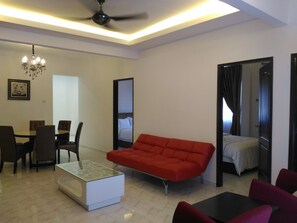 Apartment, 3 Bedrooms | Living area | Flat-screen TV