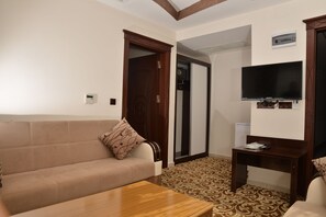Family Suite, 1 Bedroom | Living room | LCD TV