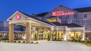 A Hilton Garden Inn with a modern entrance, stone pillars, and a clear sign indicating the name and address. - Hilton Garden Inn Salina (Salina)